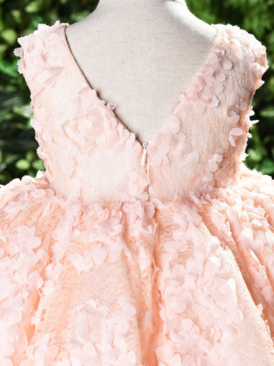 Baby tulle dress' bodice has a delicate flower applique in tulle, has a multicolor layered skirt and bow at the back