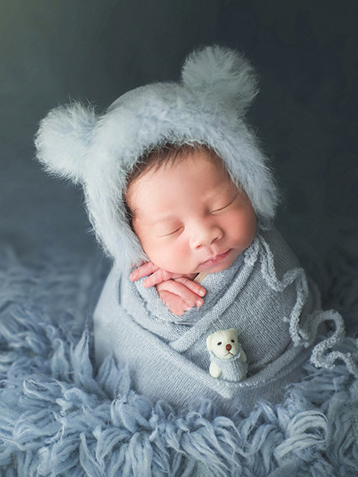 Baby set features a knitted shawl - wrap with a faux fur cap with ears and a little doll blue
