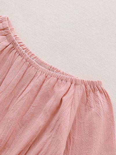 Baby boho style onesie has ruffled long sleeves and a cute bow at the front